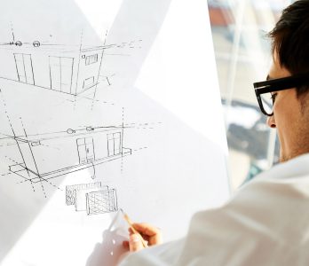 A designer designs a secondary substation on a sketch pad