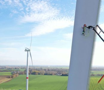 A robot performs an inspection on a wind turbine